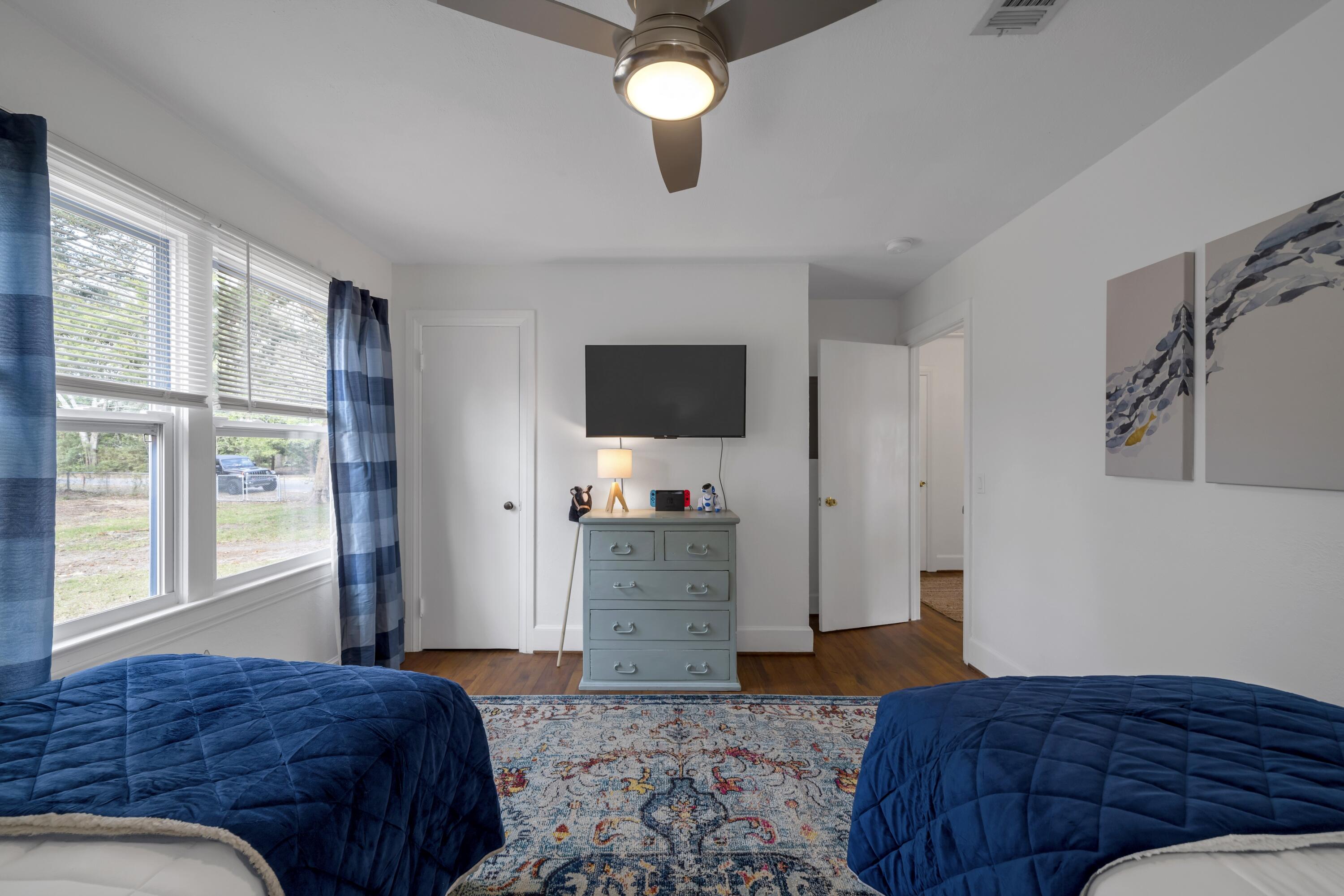 13382 Highway 20 Freeport, FL 32439 - Photo 15 of 43 a bedroom with a bed and flat screen tv