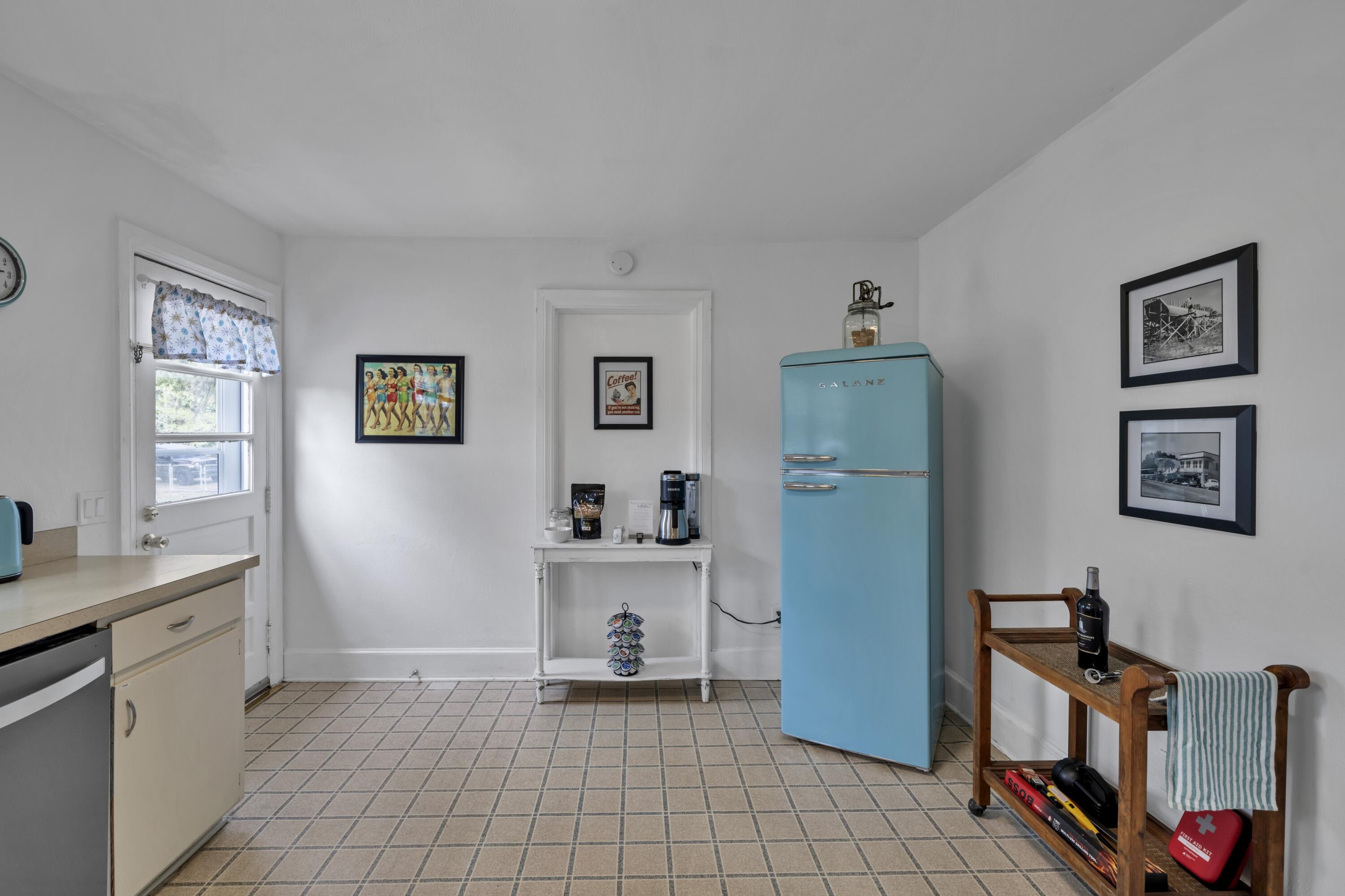 13382 Highway 20 Freeport, FL 32439 - Photo 17 of 43 a view of a kitchen with fridge and workspace