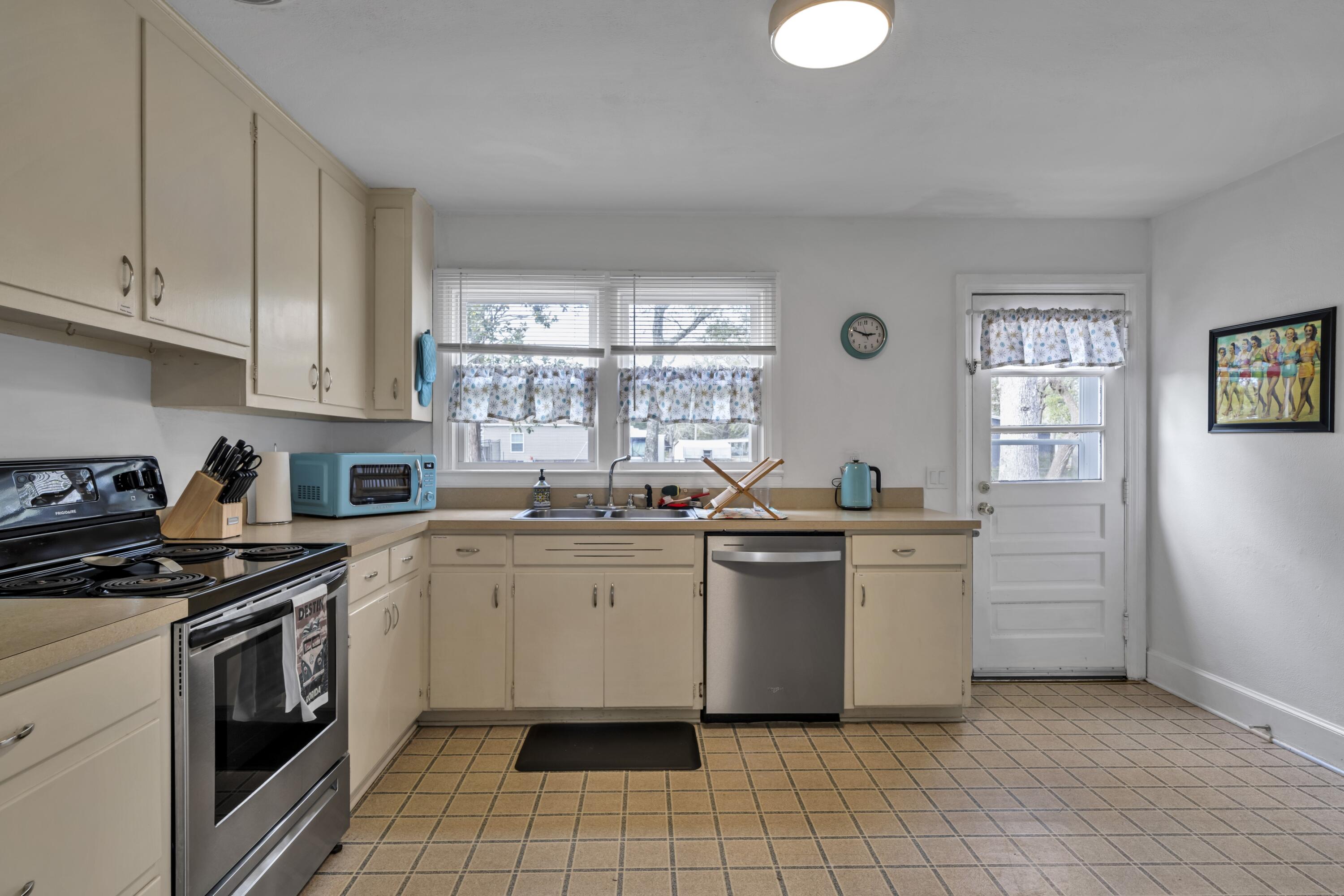 13382 Highway 20 Freeport, FL 32439 - Photo 23 of 43 a kitchen with a stove sink and cabinets