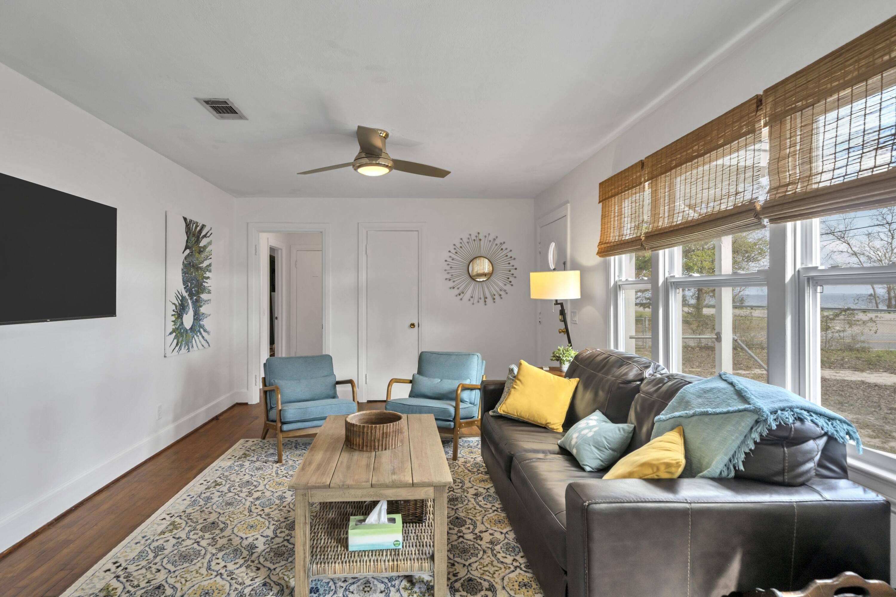 13382 Highway 20 Freeport, FL 32439 - Photo 28 of 43 a living room with furniture and a flat screen tv