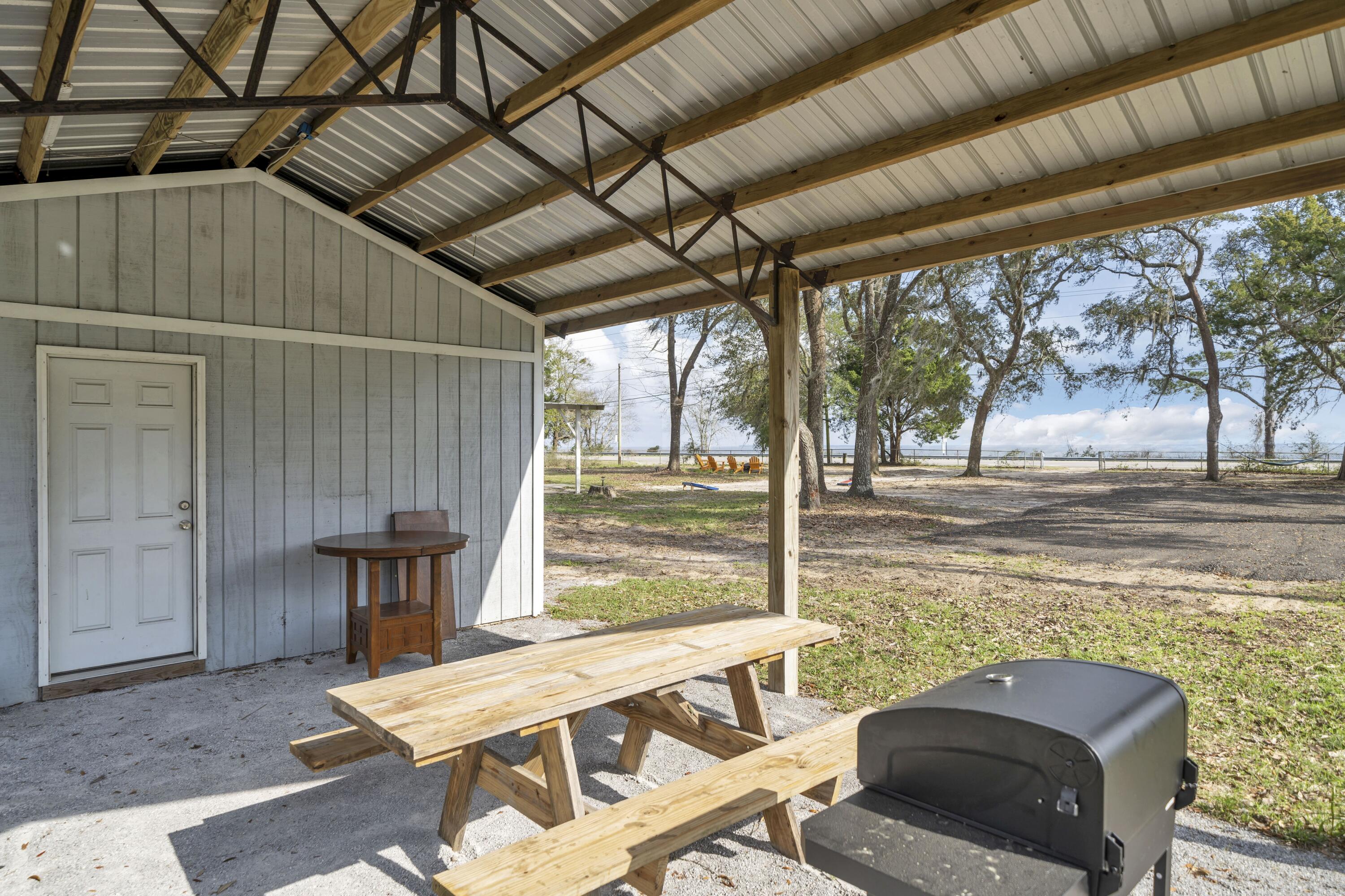 13382 Highway 20 Freeport, FL 32439 - Photo 38 of 43 a view of a patio with a table and chairs