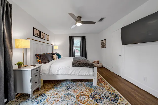 a bathroom with a sink toilet and window
