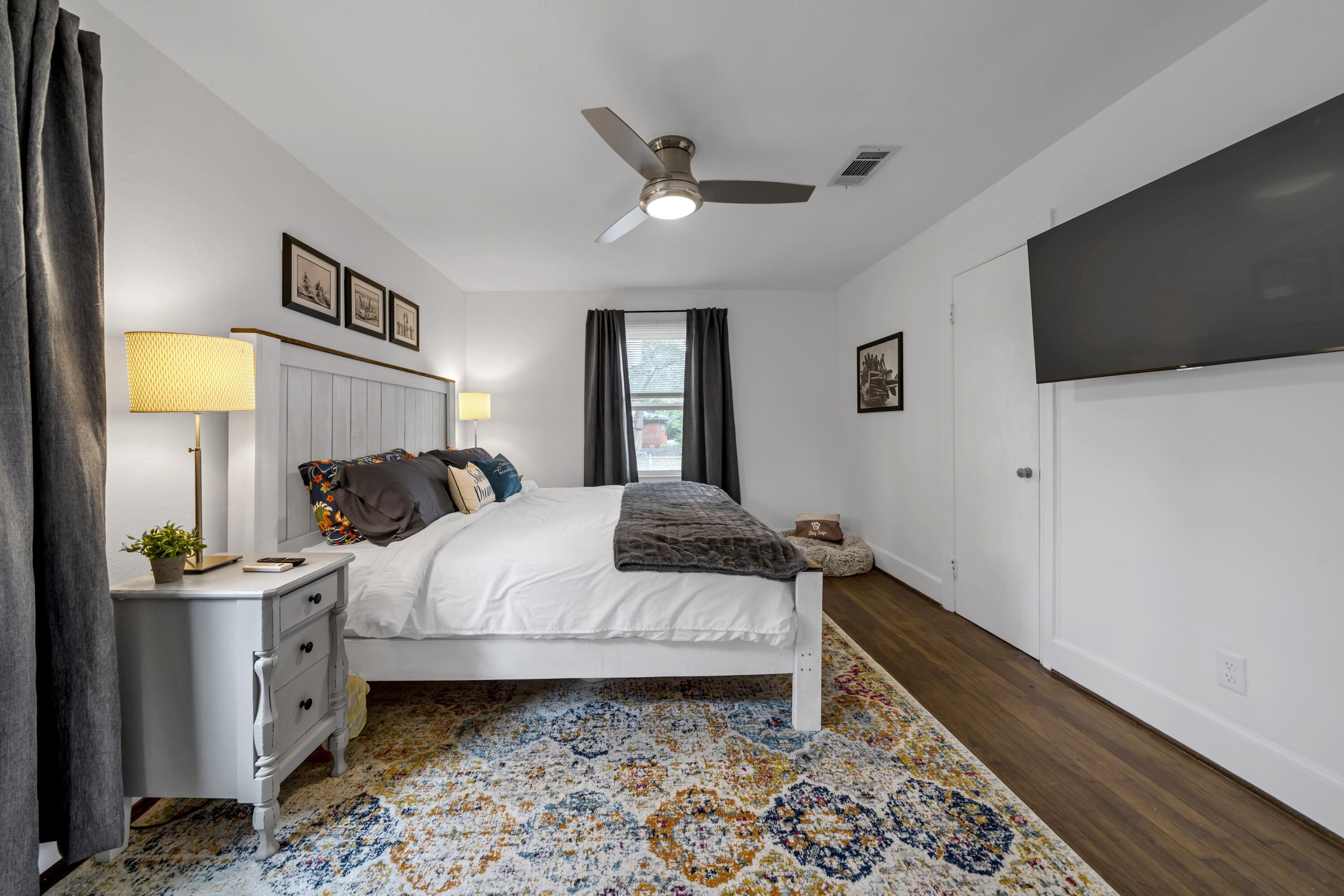 13382 Highway 20 Freeport, FL 32439 - Photo 9 of 43 a bedroom with a bed and a flat screen tv