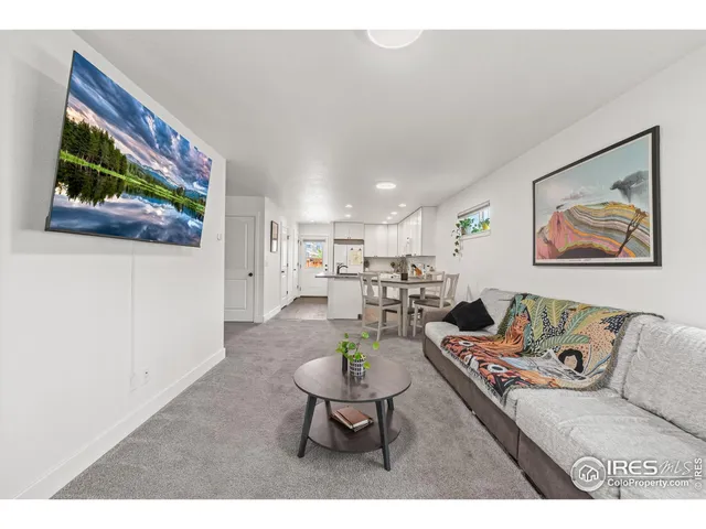 a bedroom with a bed and a potted plant