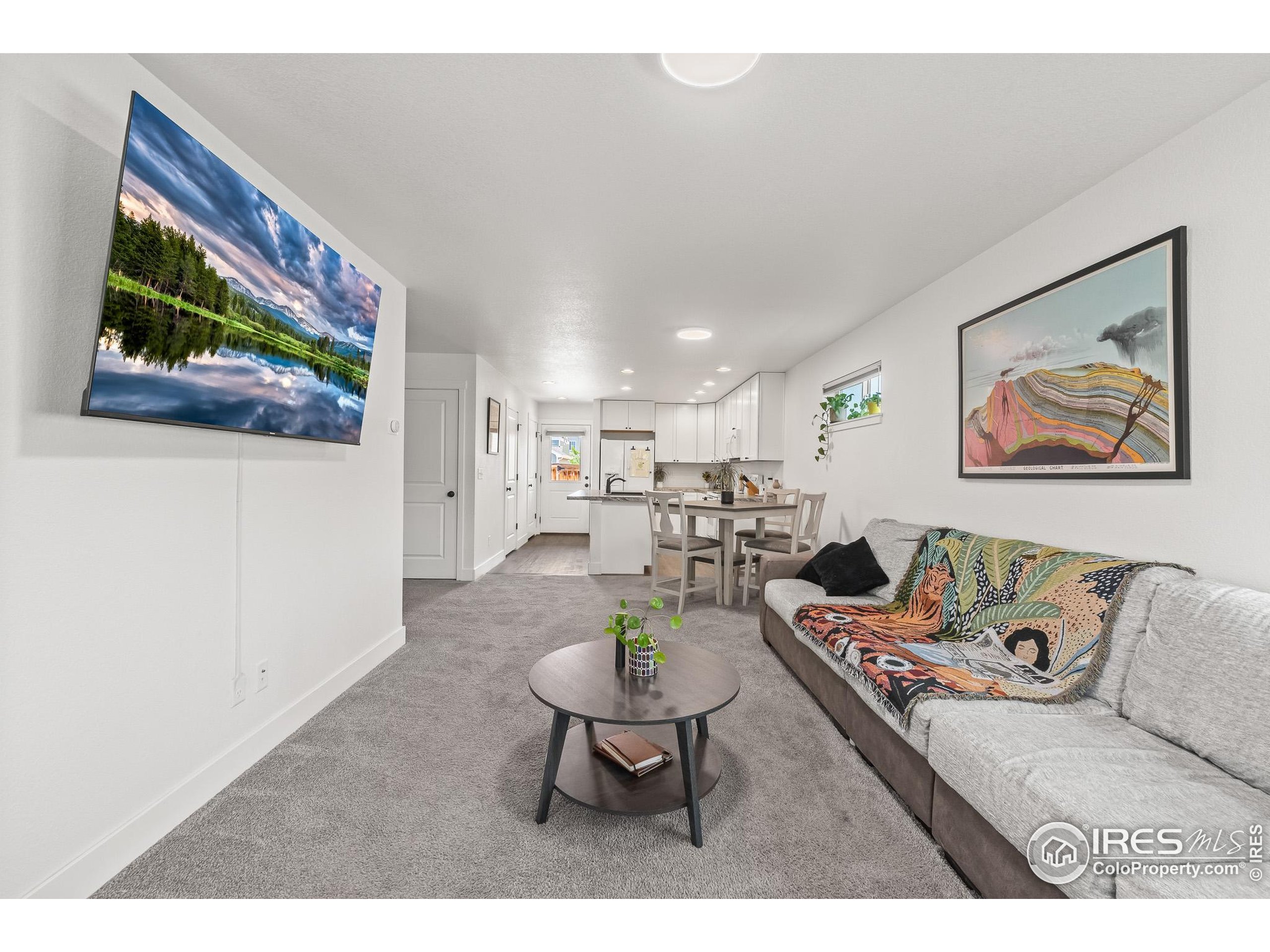 2771 Red Wheat Trail Berthoud, CO 80513 - Photo 13 of 46 a living room with furniture and a flat screen tv