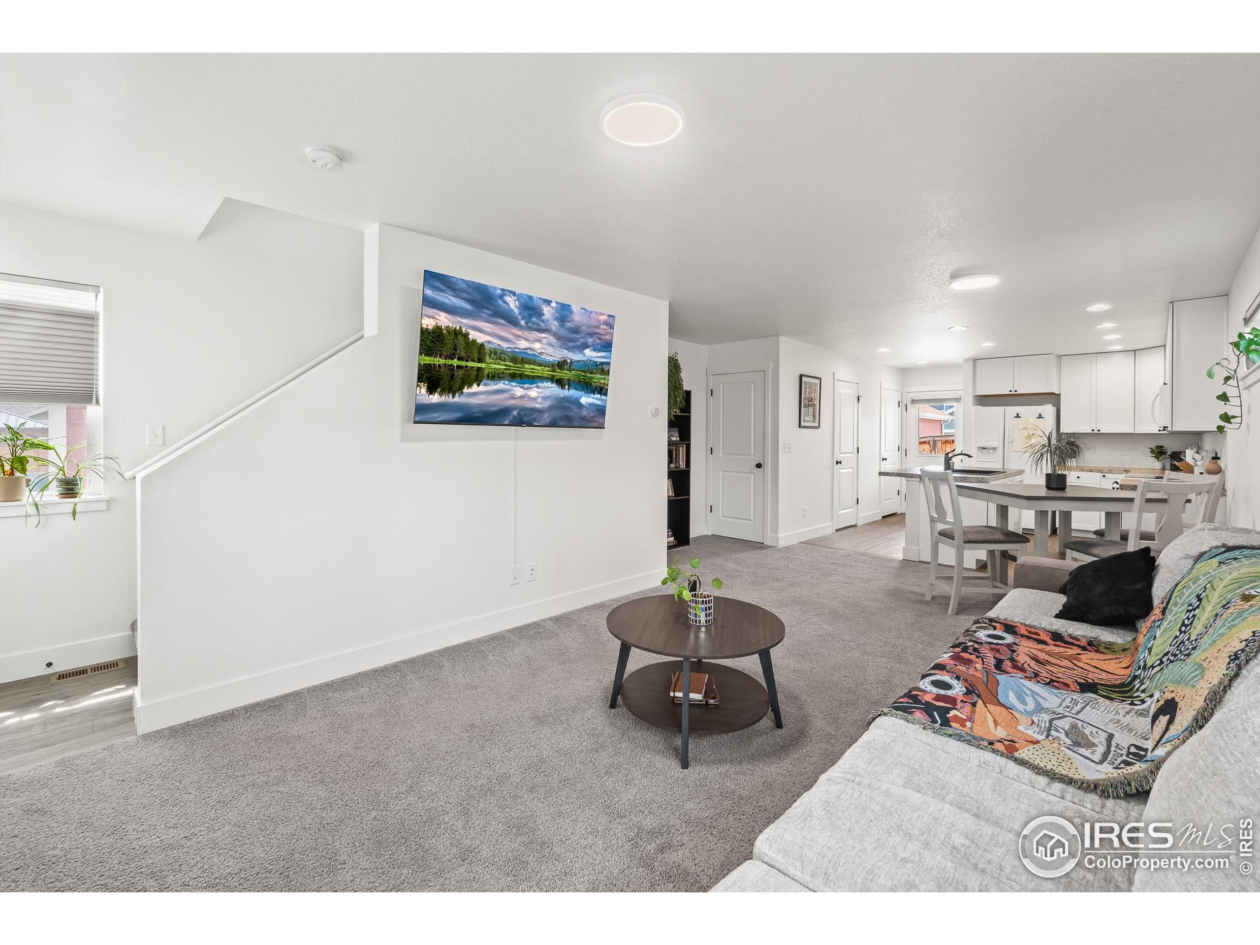 2771 Red Wheat Trail Berthoud, CO 80513 - Photo 14 of 46 a living room with furniture and kitchen view