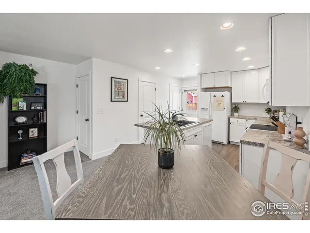 a view of a workspace with furniture