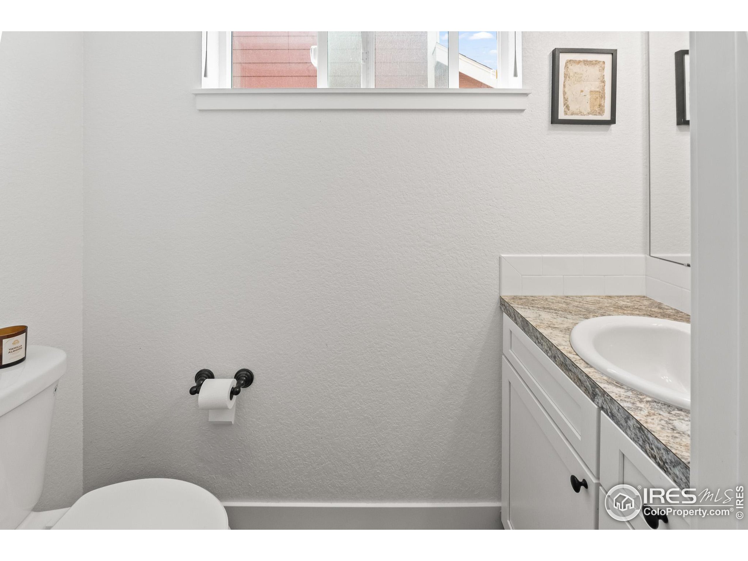 2771 Red Wheat Trail Berthoud, CO 80513 - Photo 25 of 46 a bathroom with a sink and mirror
