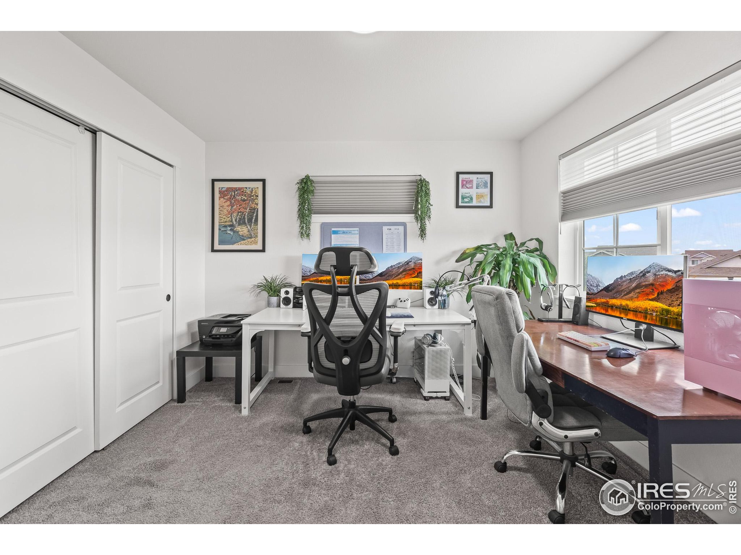 2771 Red Wheat Trail Berthoud, CO 80513 - Photo 35 of 46 a view of a workspace with furniture and a window