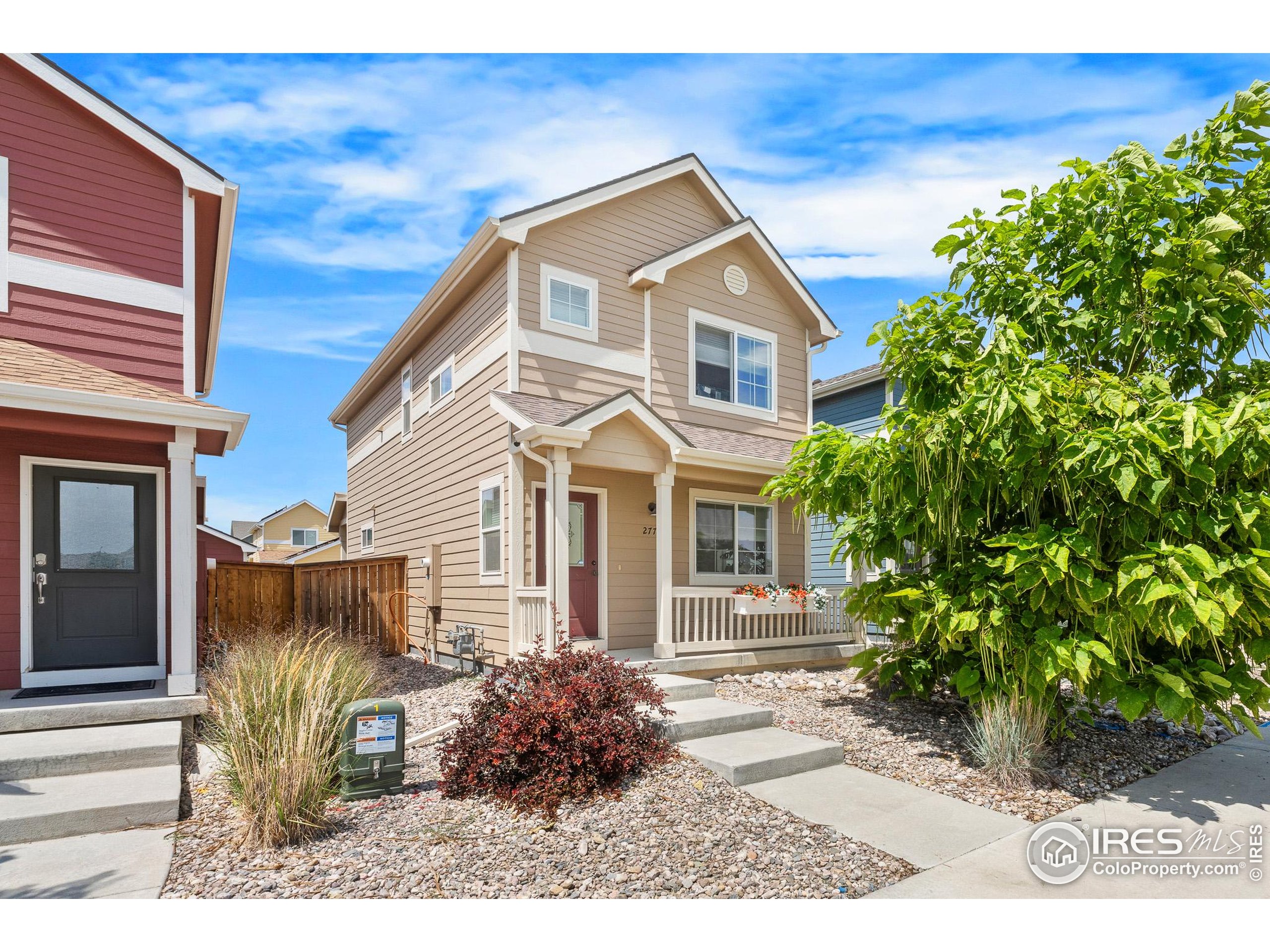 2771 Red Wheat Trail Berthoud, CO 80513 - Photo 44 of 46 a front view of a house with garden