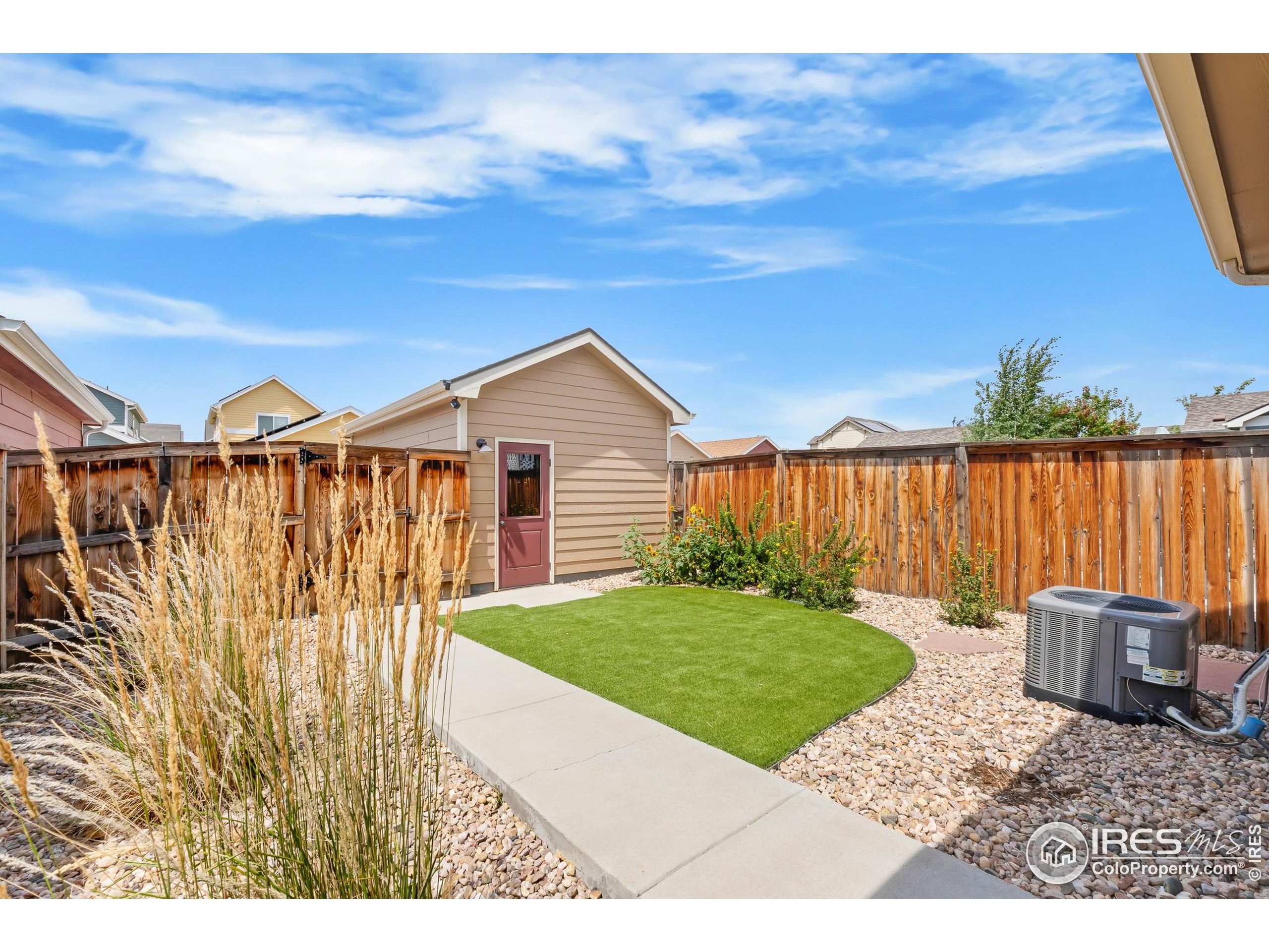 2771 Red Wheat Trail Berthoud, CO 80513 - Photo 8 of 46 a view of a backyard with wooden fence