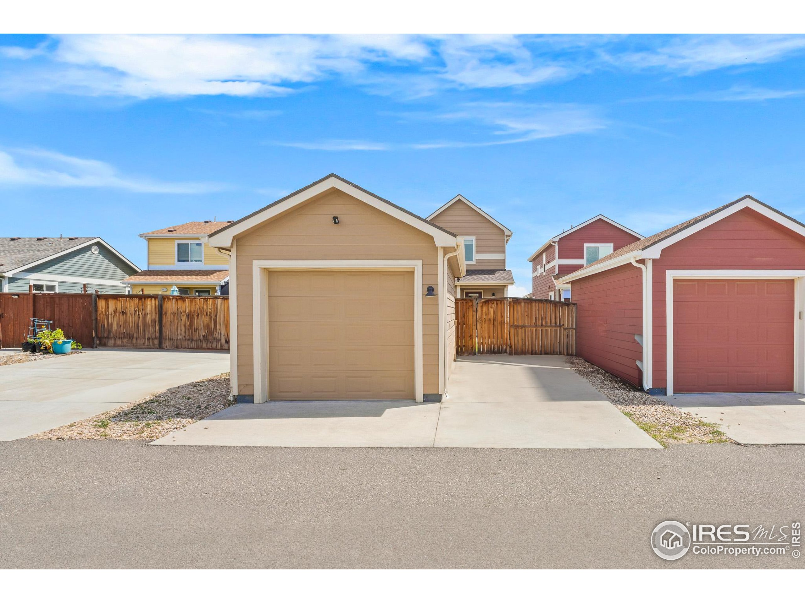 2771 Red Wheat Trail Berthoud, CO 80513 - Photo 9 of 46 a front view of a house with a yard and garage