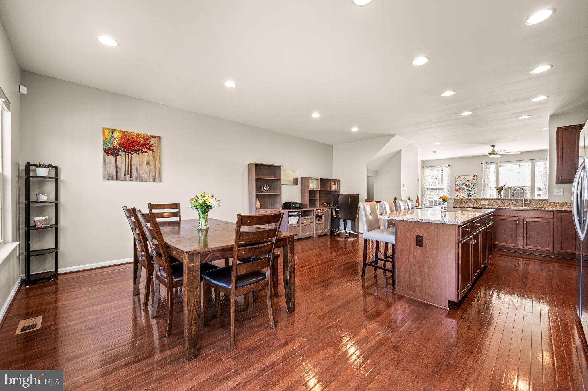 603 Columbus Drive Spring City, PA 19475 - Photo 15 of 35 a living room with stainless steel appliances kitchen island granite countertop furniture wooden floor and a view of kitchen