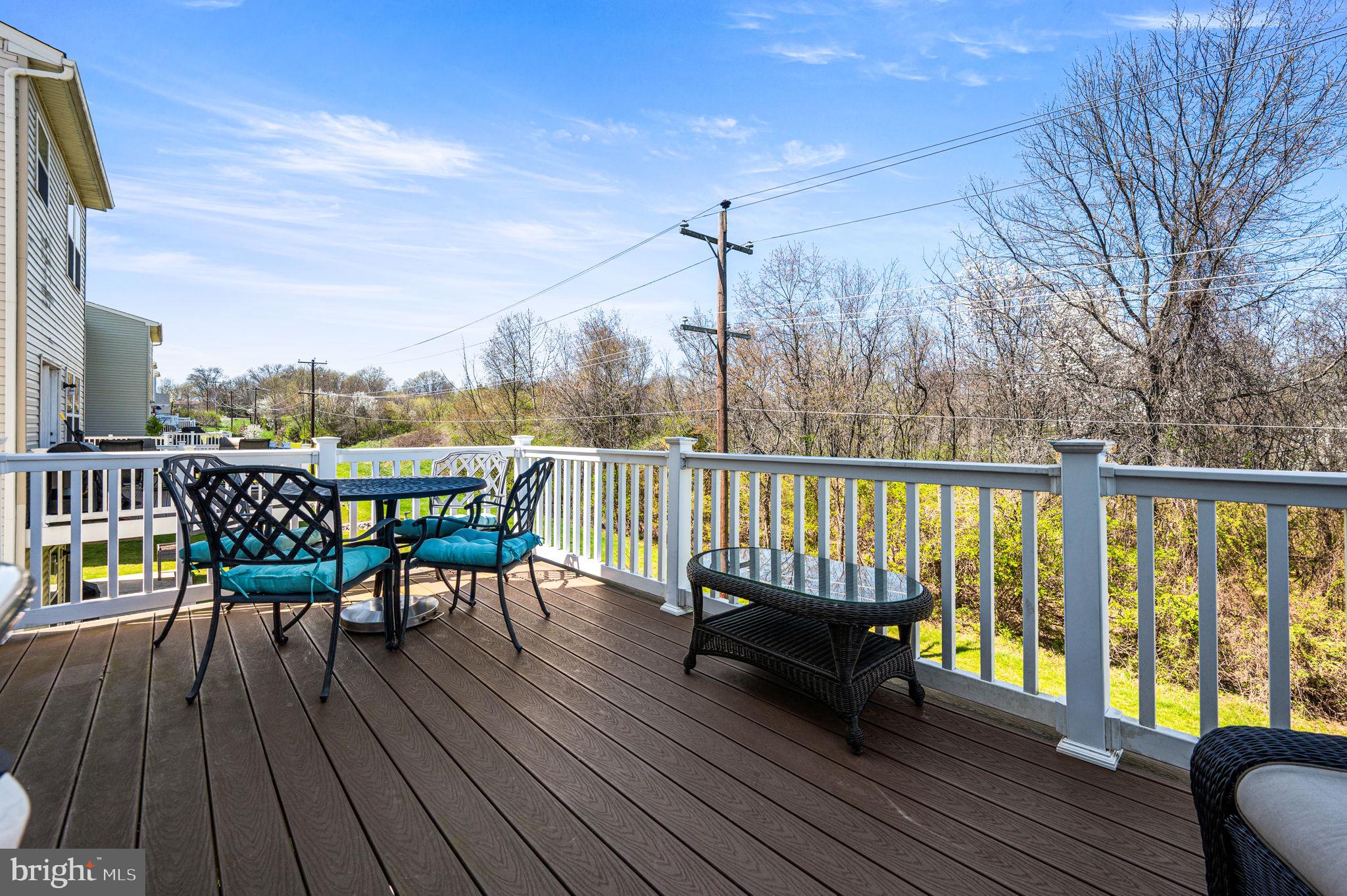 603 Columbus Drive Spring City, PA 19475 - Photo 18 of 35 a view of a deck with table and chairs and wooden floor