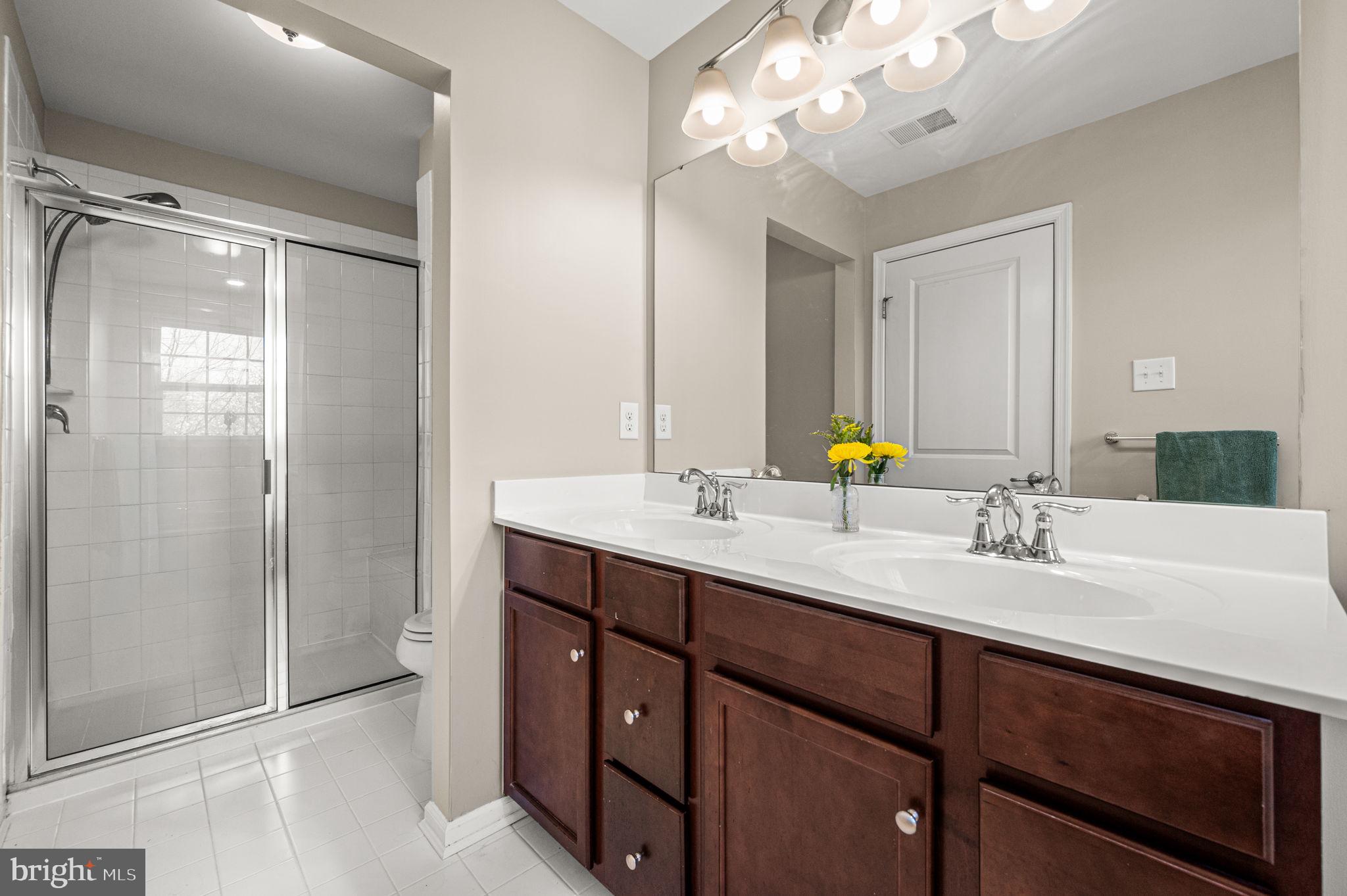 603 Columbus Drive Spring City, PA 19475 - Photo 24 of 35 a bathroom with a sink double vanity and a mirror
