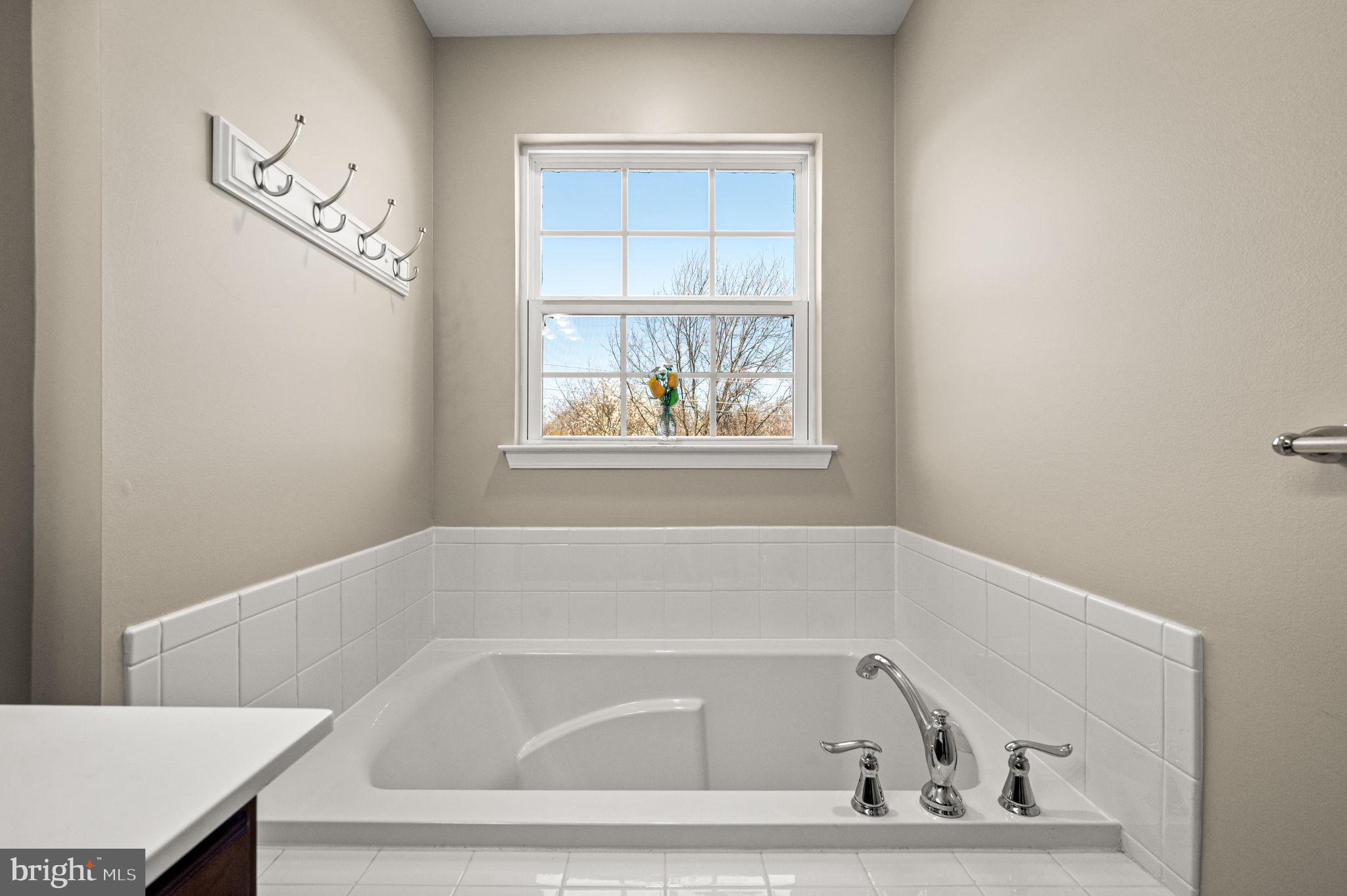 603 Columbus Drive Spring City, PA 19475 - Photo 25 of 35 a bathroom with a bathtub and a window