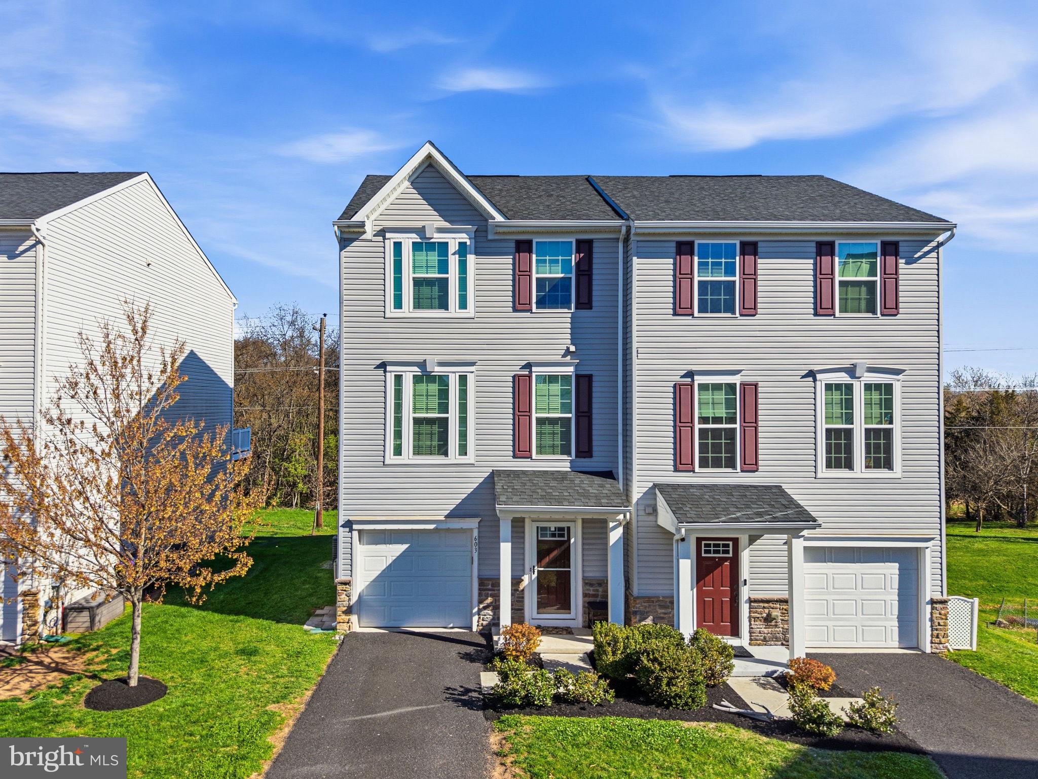 603 Columbus Drive Spring City, PA 19475 - Photo 5 of 35 a front view of a house with garden