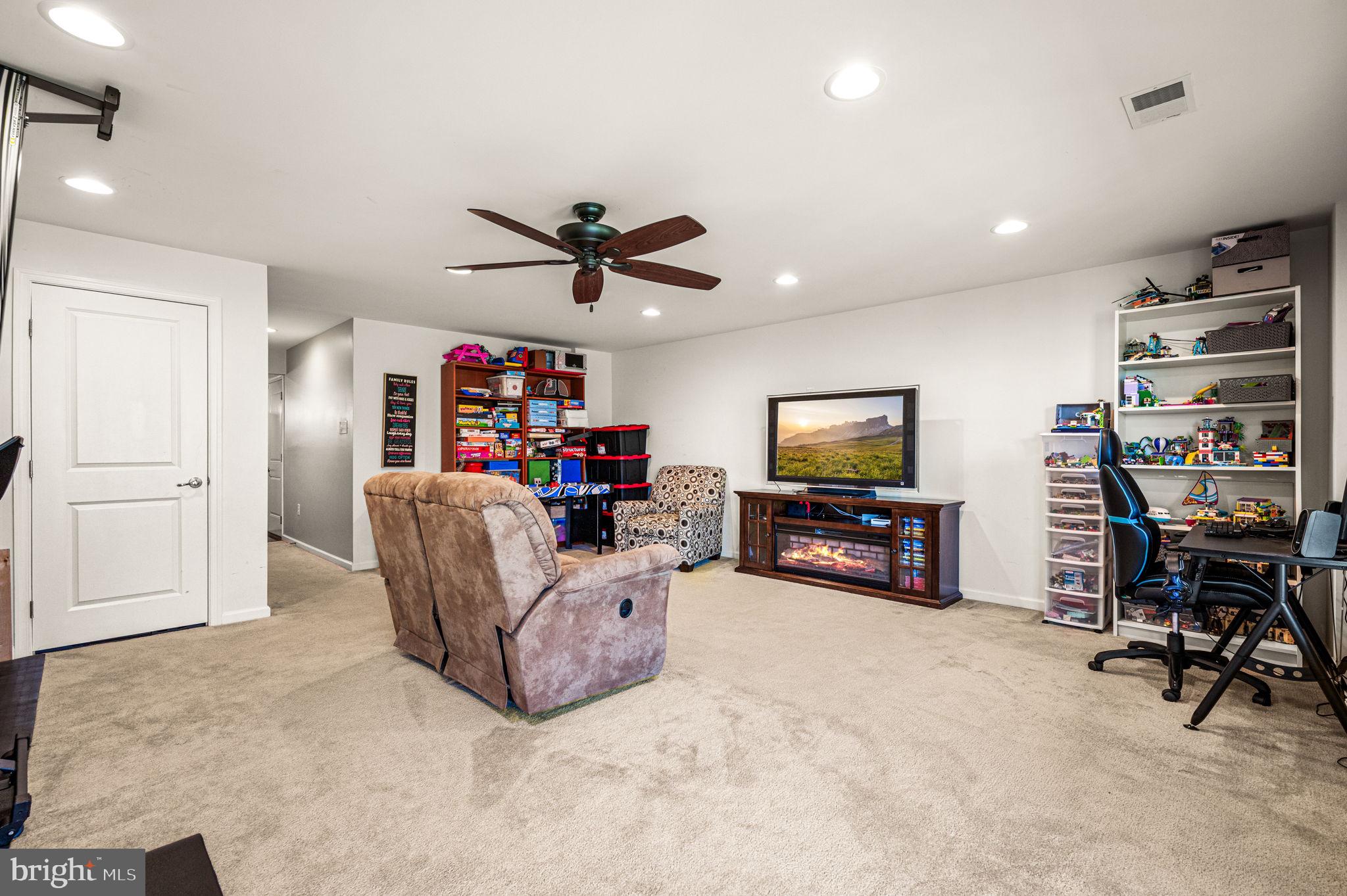603 Columbus Drive Spring City, PA 19475 - Photo 9 of 35 a living room with furniture and a flat screen tv