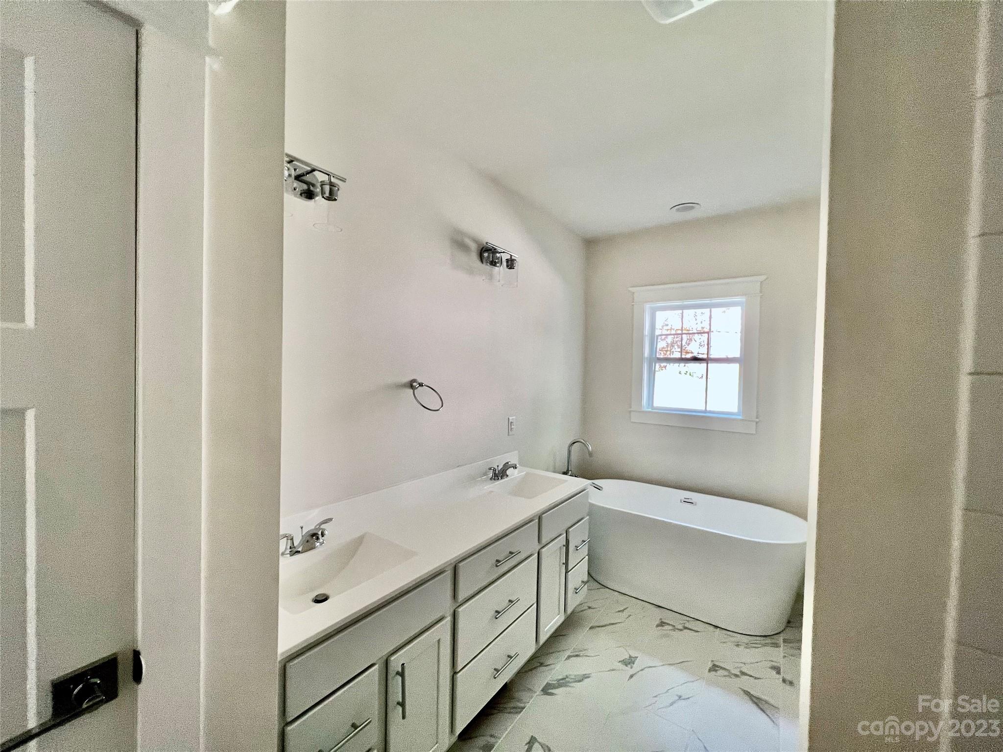170 Cascade Rdg Road Fairview, NC 28730 - Photo 12 of 23 a bathroom with a sink a toilet and shower