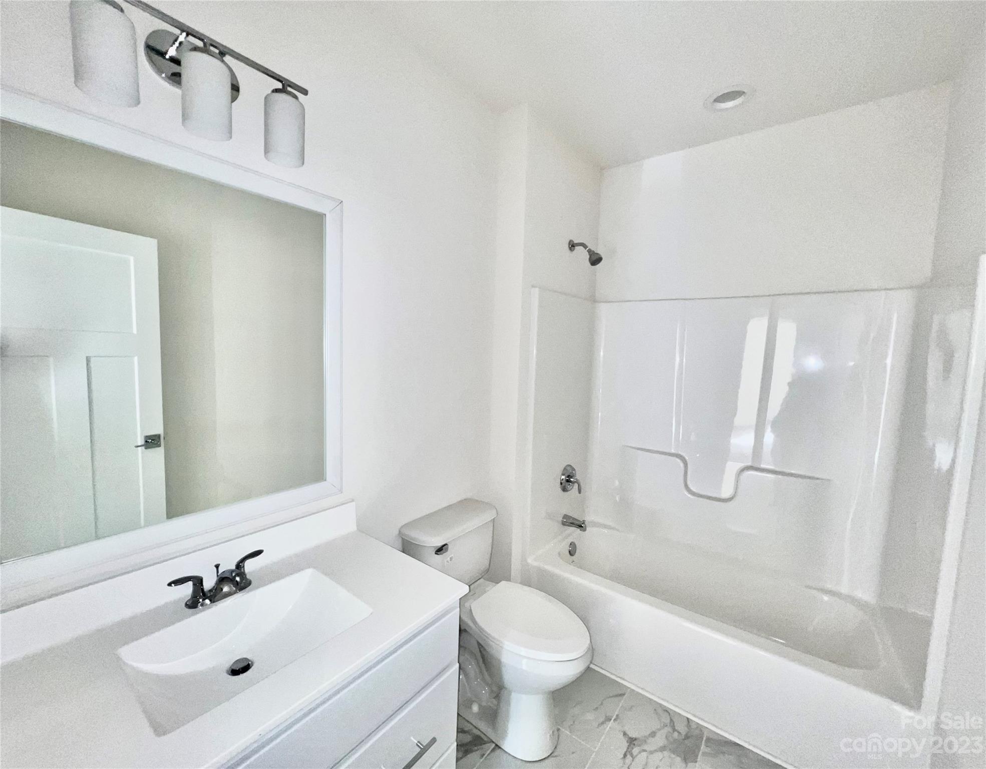 170 Cascade Rdg Road Fairview, NC 28730 - Photo 16 of 23 a bathroom with a sink toilet a mirror and shower