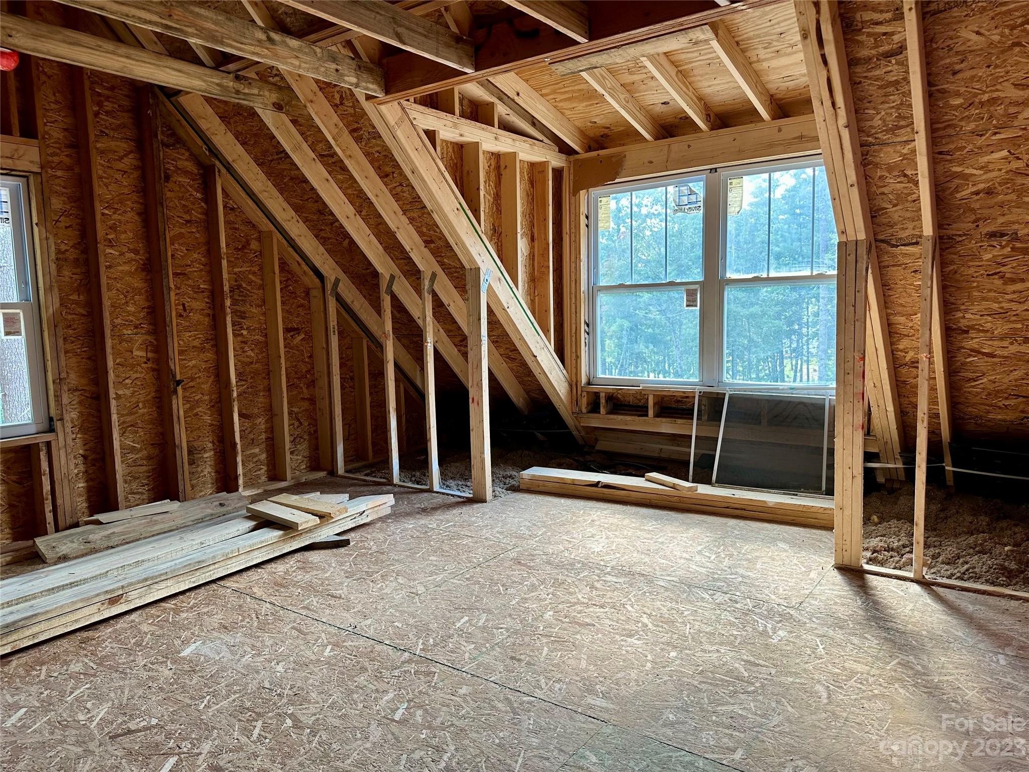 170 Cascade Rdg Road Fairview, NC 28730 - Photo 20 of 23 a view of an empty room with wooden floor and windows