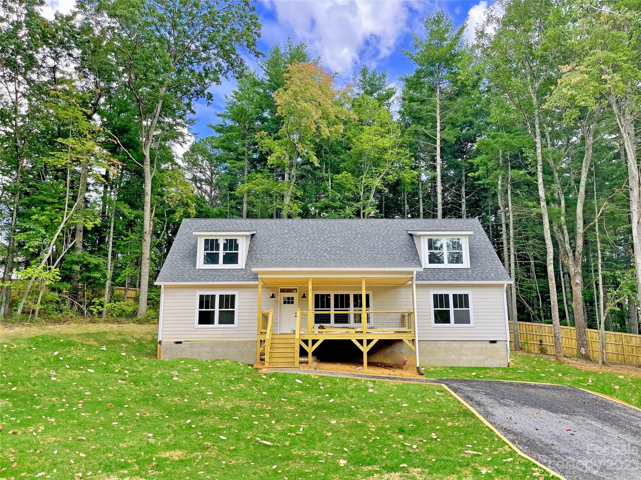 170 Cascade Rdg Road Fairview, NC 28730 - Photo 2 of 23 a front view of a house with garden