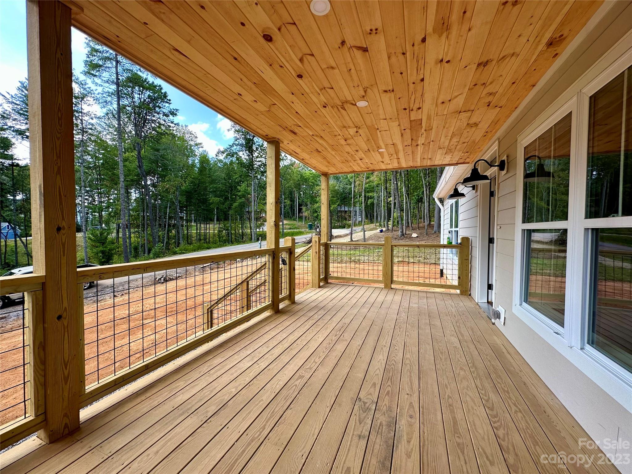 170 Cascade Rdg Road Fairview, NC 28730 - Photo 3 of 23 a view of porch with wooden floor and fence