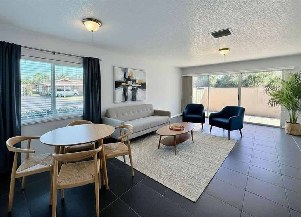 2284 Oak Neck Road, Unit F Clearwater, FL 33763 - Photo 12 of 34 a living room with furniture and a large window