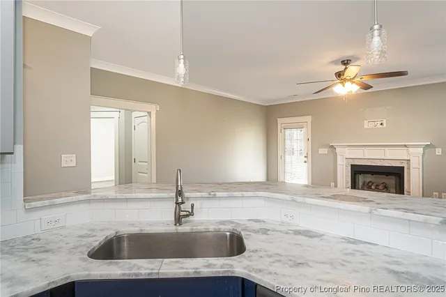 a bathroom with a sink a large mirror and vanity
