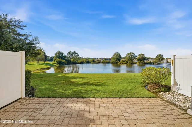 a bathroom with a glass shower door and a sink