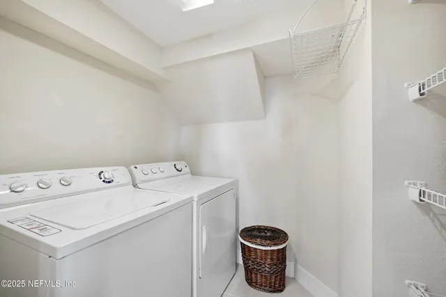 a view of a hallway with wooden floor and entryway