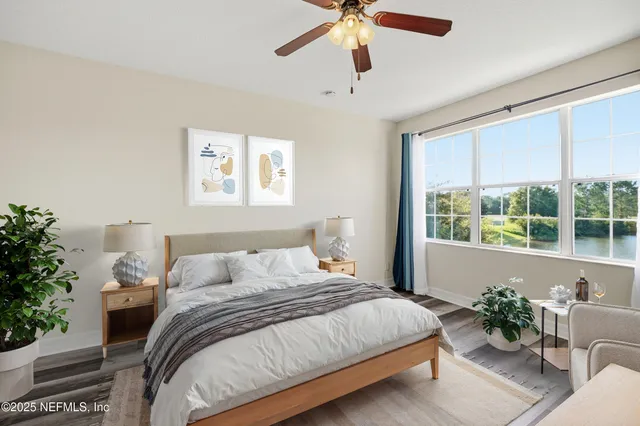 an aerial view of a house with outdoor space and lake view