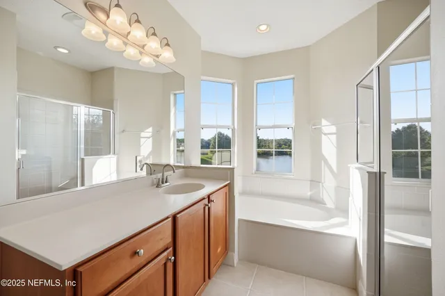 a view of a lake with boats and trees in the background