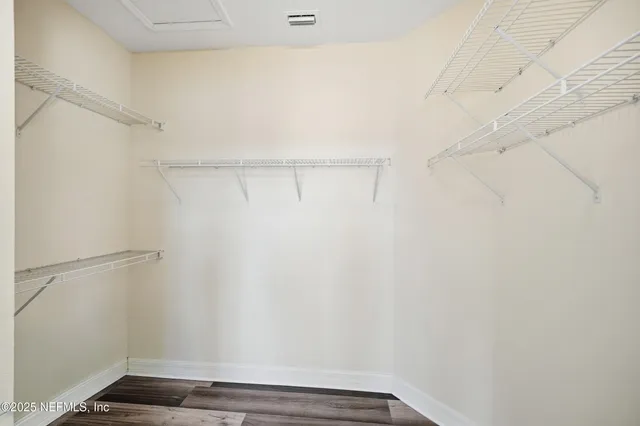 an aerial view of a house with yard swimming pool and ocean view