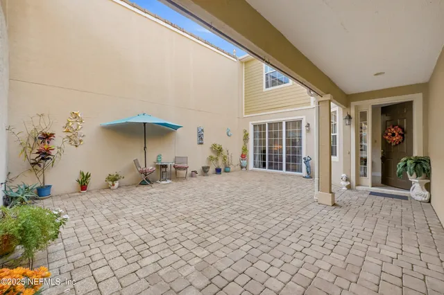 a living room with furniture a ceiling fan and a rug