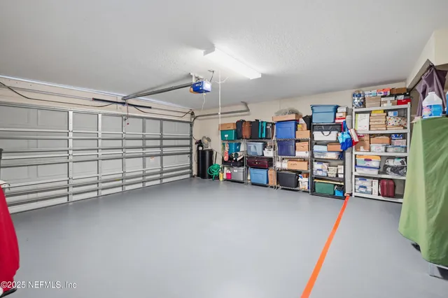 a view of a dining room with furniture wooden floor and chandelier