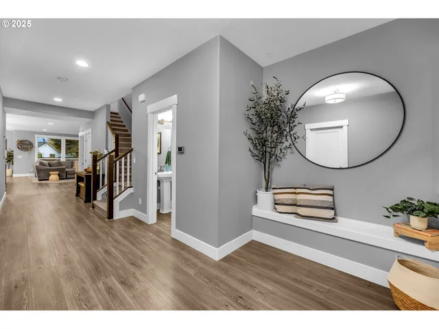 a view of a livingroom with furniture and a mirror