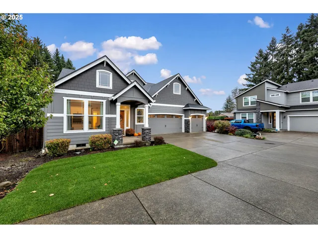a front view of a house with a garden