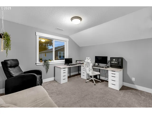 a living room with furniture and flat screen tv
