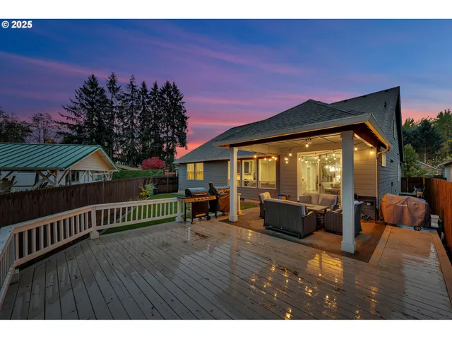 a view of living room with furniture and wooden floor