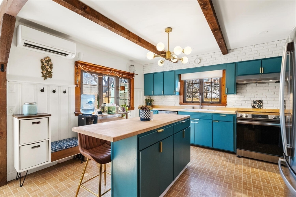 21 Gee Avenue Gloucester, MA 01930 - Photo 16 of 35 a kitchen with stainless steel appliances granite countertop a sink and wooden cabinets