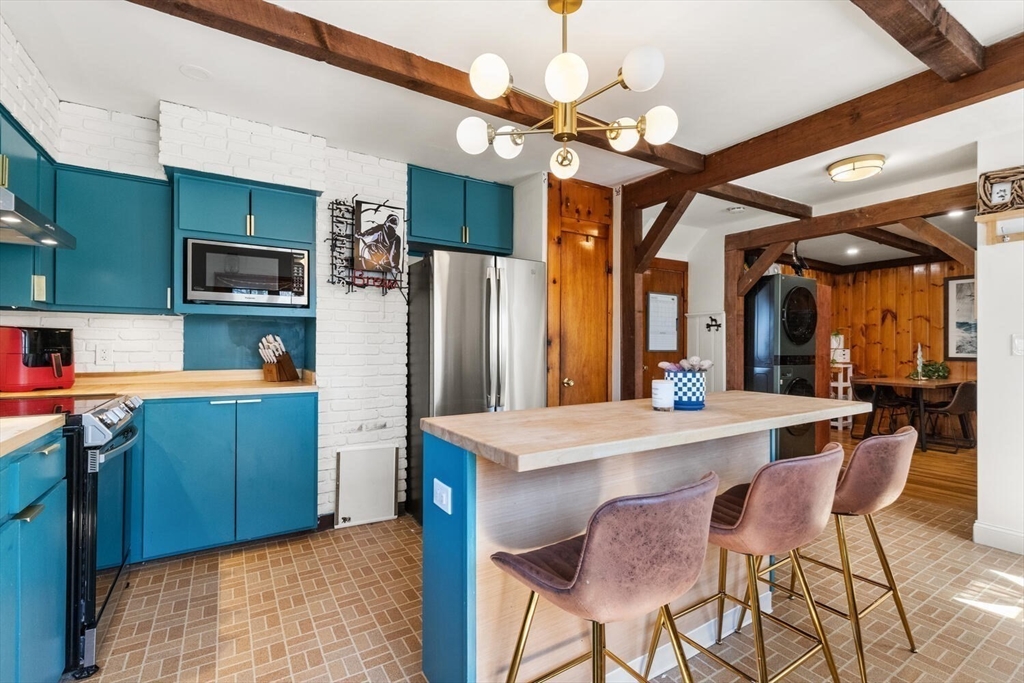 21 Gee Avenue Gloucester, MA 01930 - Photo 18 of 35 a kitchen with cabinets a counter space and stainless steel appliances