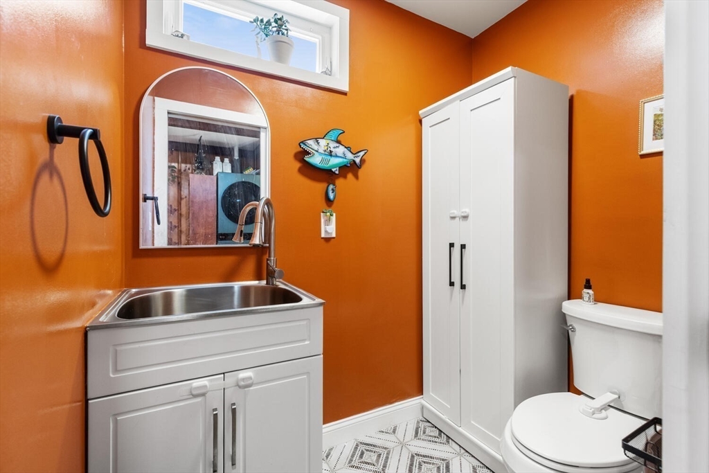 21 Gee Avenue Gloucester, MA 01930 - Photo 20 of 35 a bathroom with a sink a toilet and shower