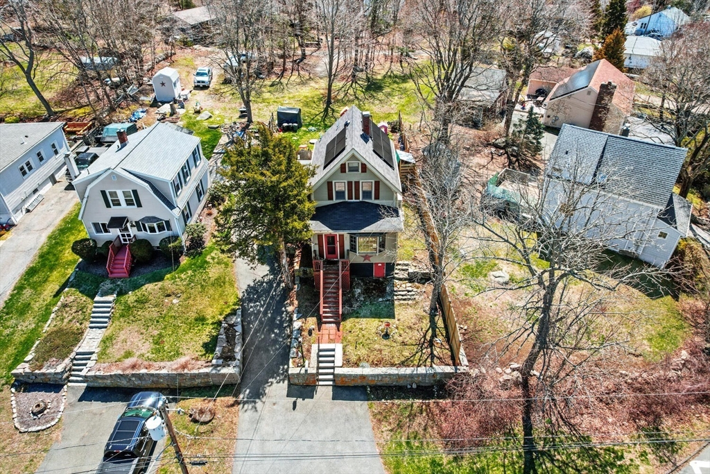 21 Gee Avenue Gloucester, MA 01930 - Photo 2 of 35 an aerial view of a house with a yard and large trees