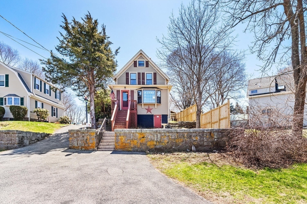 21 Gee Avenue Gloucester, MA 01930 - Photo 35 of 35 a front view of a house with a yard and large tree