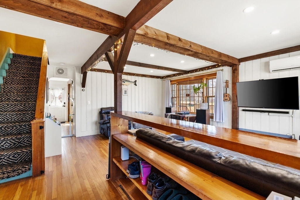 21 Gee Avenue Gloucester, MA 01930 - Photo 7 of 35 a living room with furniture flat screen tv and a table