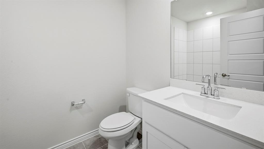 403 Flintlock Road Caddo Mills, TX 75135 - Photo 2 of 26 Half bath featuring vanity, tile patterned floors, and recessed lighting