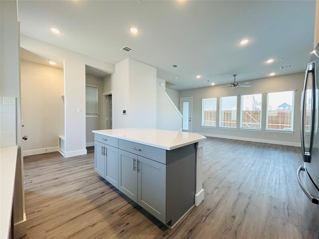 760 West Bedford Euless Road, Unit 214 Hurst, TX 76053 - Photo 20 of 32 an empty room with wooden floor and windows