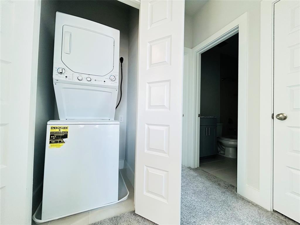 760 West Bedford Euless Road, Unit 214 Hurst, TX 76053 - Photo 27 of 32 a utility room with dryer and washer