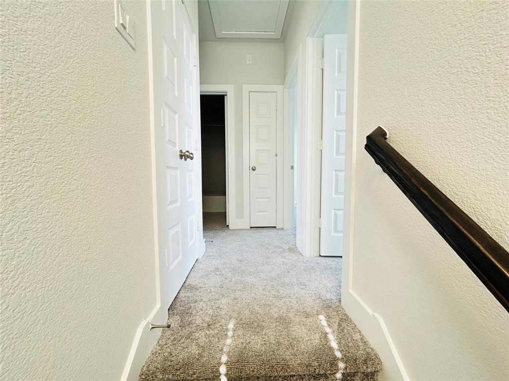 760 West Bedford Euless Road, Unit 214 Hurst, TX 76053 - Photo 28 of 32 a view of a hallway with wooden floor and staircase